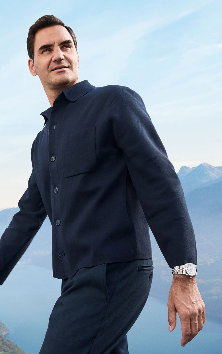 Rolex Testimonee Roger Federer wearing a Land-Dweller watch in a mountainous outdoor setting - AH Riise US Virgin Islands Rolex Testimonee Roger Federer wearing a Land-Dweller watch in a mountainous outdoor setting - AH Riise US Virgin Islands